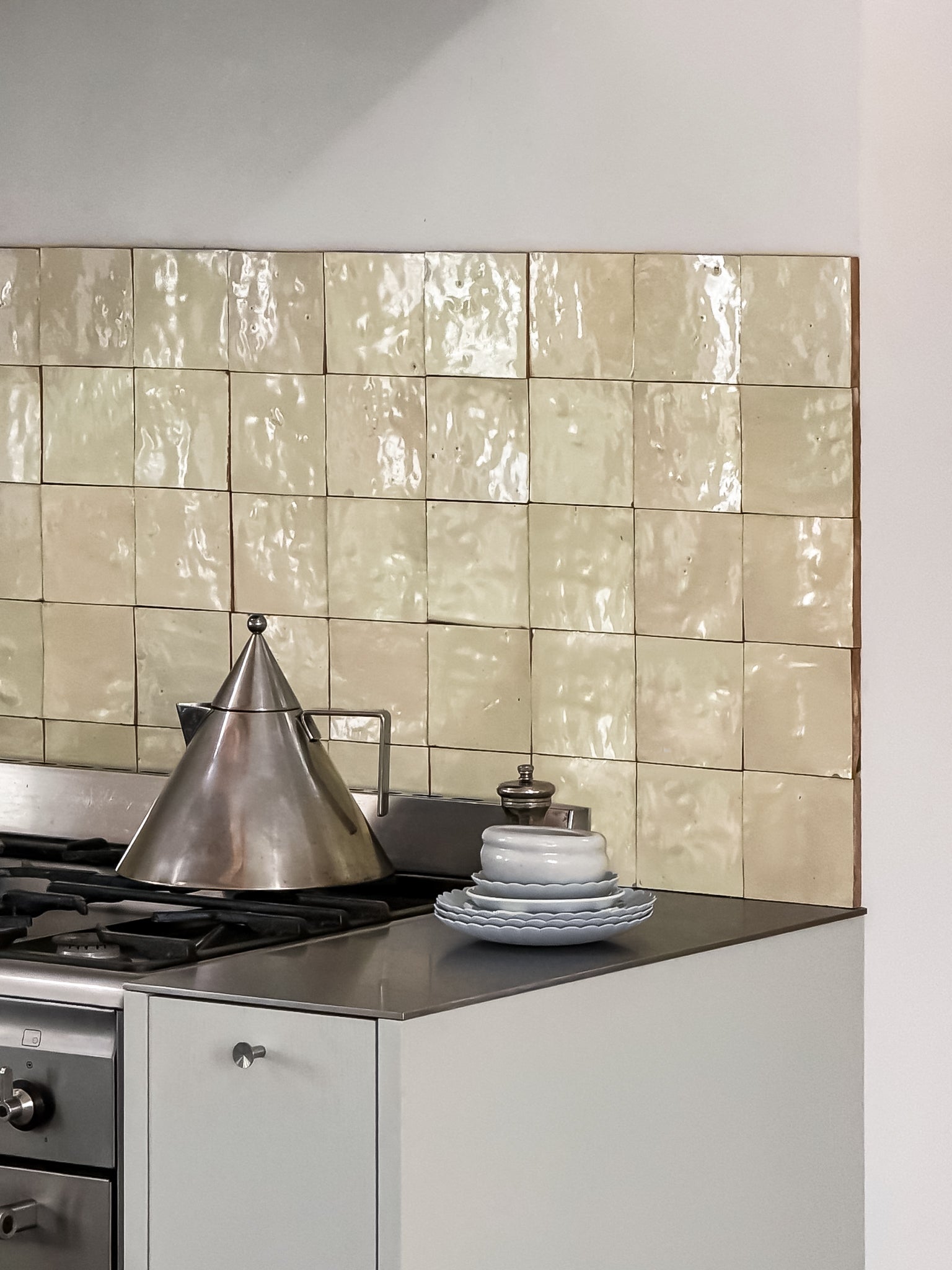 Kitchen in Troense, Denmark featuring handmade Vanilla ceramic tiles by Muller Van Severen as a backsplash.
