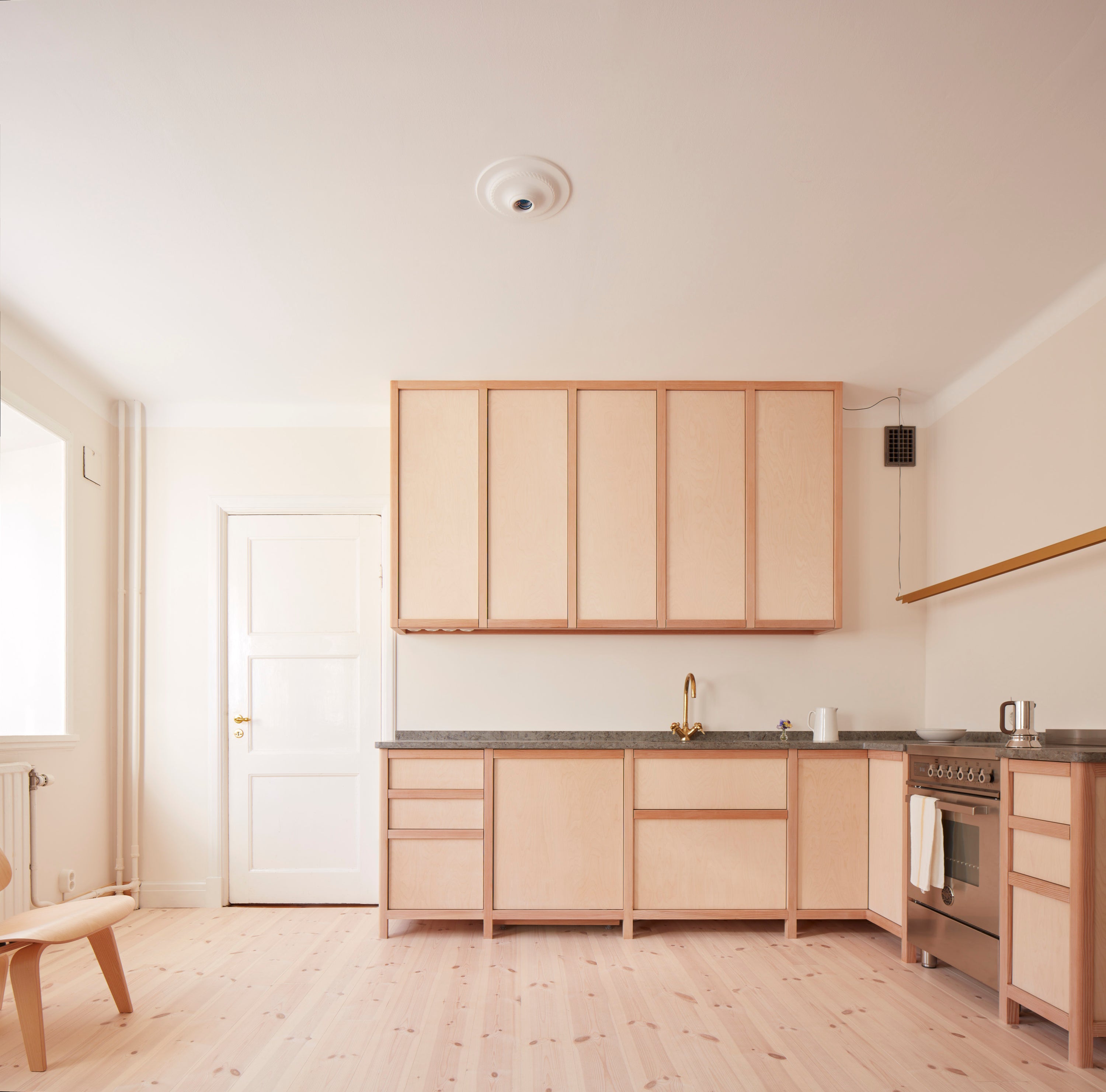 Kitchen in Oslo painted in colours designed by Daniel Rybakken for Blēo Collective