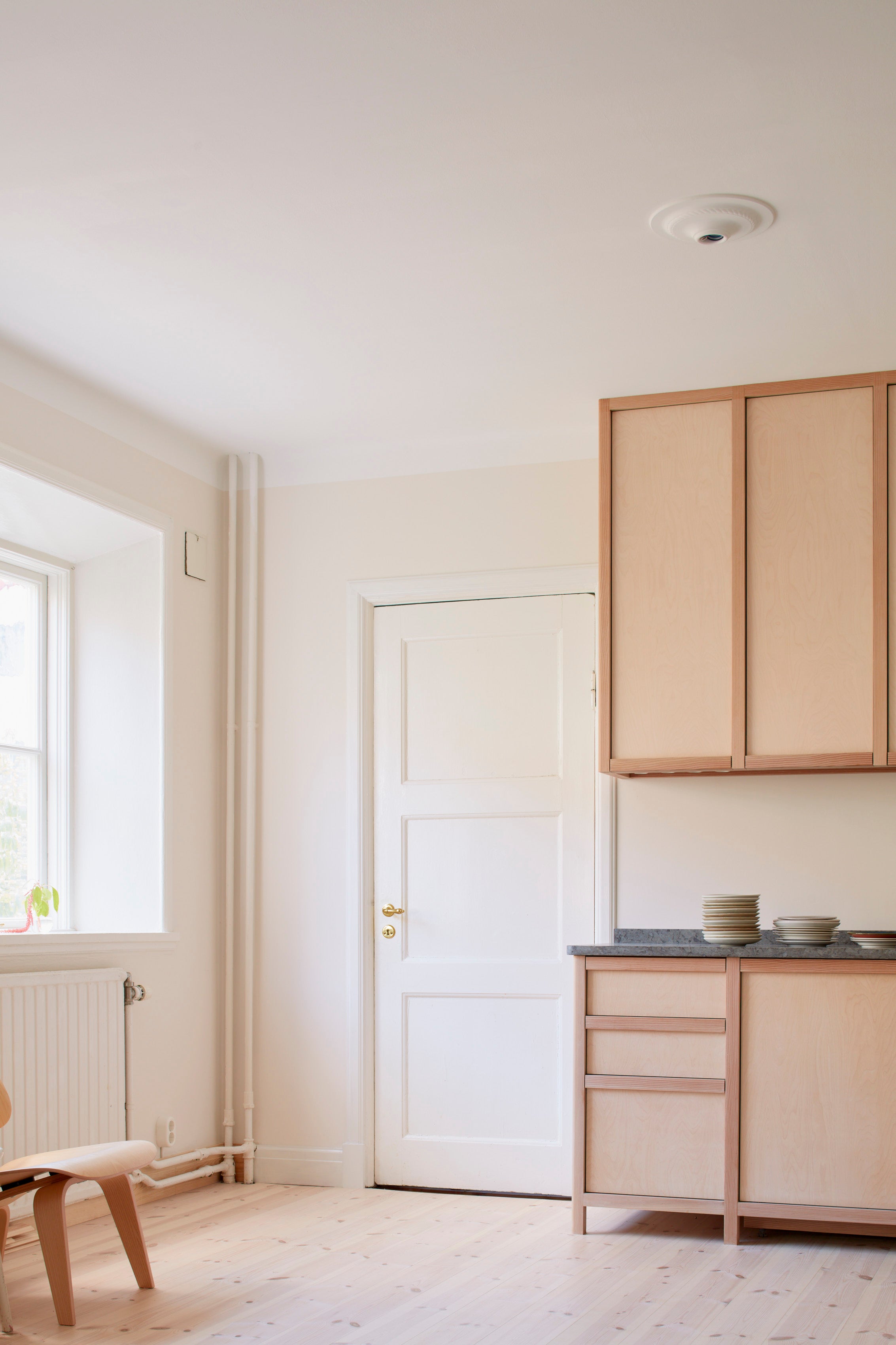 Kitchen in Oslo painted in colours designed by Daniel Rybakken for Blēo Collective